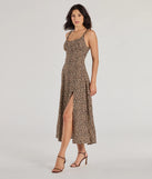The Elevated Leopard Print Woven A-Line Midi Dress is a brown dress, an essential holiday or NYE dress that pairs chic style with versatility making it perfect for cocktail events, New Year's Eve parties, or as a winter wedding guest look.