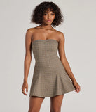 The Adorable Look Plaid Print Strapless Skater Dress is a taupe dress, an essential holiday or NYE dress that pairs chic style with versatility making it perfect for cocktail events, New Year's Eve parties, or as a winter wedding guest look.