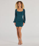 The Glitzy Affair Glitter Mesh Long Sleeve Mini Dress is a hunter green dress, an essential holiday or NYE dress that pairs chic style with versatility making it perfect for cocktail events, New Year's Eve parties, or as a winter wedding guest look.
