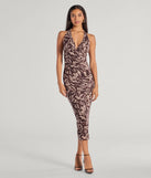 Elevate your winter wardrobe with the Fierce Style Zebra Print Mesh Halter Midi Dress— a party-ready brown cocktail dress featuring seasonal accents and a sophisticated style, ideal for semi-formal holiday events from family dinners to NYE celebrations.