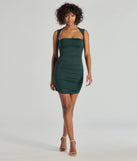 The Curves Ahead Ruched Mini Dress is a hunter green dress, an essential holiday or NYE dress that pairs chic style with versatility making it perfect for cocktail events, New Year's Eve parties, or as a winter wedding guest look.