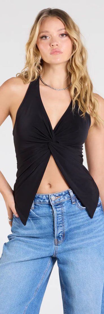 The Routinely Cute Halter Knot Crop Top in black brings edge and energy to your vibe, ready to elevate any festival look or concert outfit.
