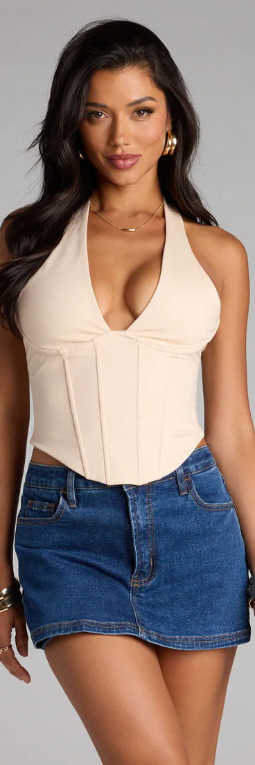 For college campus looks, game day outfits, or a bold going-out vibe, the Sleek And Stunning Corset Halter Top is an on-trend ivory crop top that easily styles with your favorite denim.