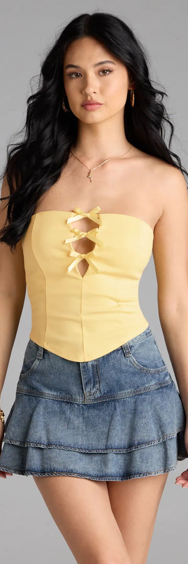 With its midriff cut and trend-forward fit, the Posh And Pretty Strapless Bow Ponte Crop Top is a yellow crop top made to pair with skirts, denim, or whatever vibe you're feeling this season.