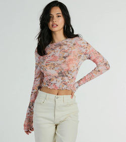 The crop top style of the Wild Flowers Long Sleeve Floral Mesh Crop Top adds a sultry detail to your going-out outfits or everyday looks.