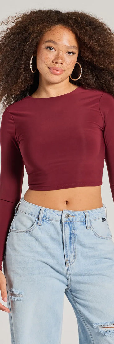 The Stop And Stare Backless Long Sleeve Top is a women's burgundy long-sleeve top with an elevated style and unique design accents, perfect for layering or transitioning into colder months.
