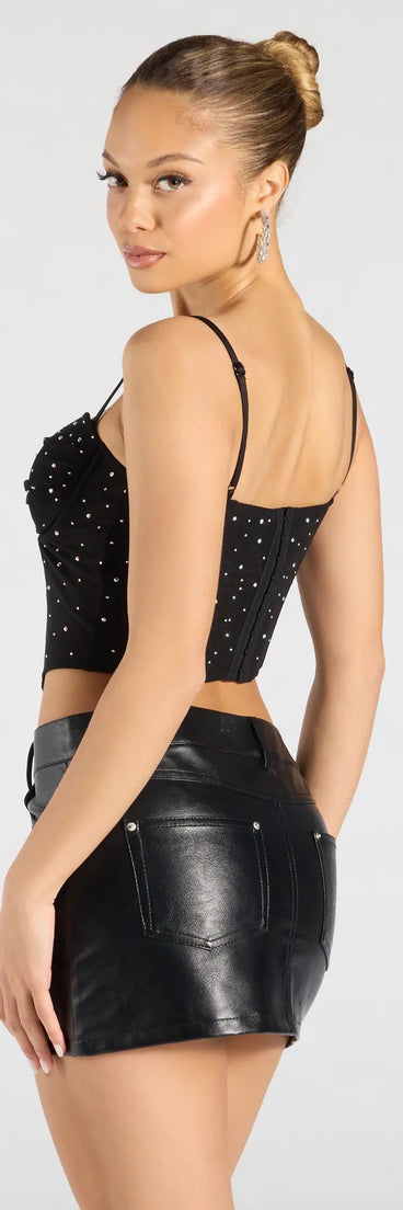 For college campus looks, game day outfits, or a bold going-out vibe, the Stunned By Luxe Rhinestone Mesh Bustier is an on-trend black crop top that easily styles with your favorite denim.