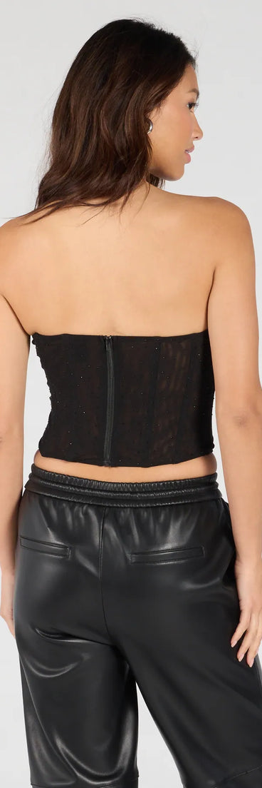 With its midriff cut and trend-forward fit, the All Eyes On You Rhinestone Mesh Corset Top is a black crop top made to pair with skirts, denim, or whatever vibe you're feeling this season.