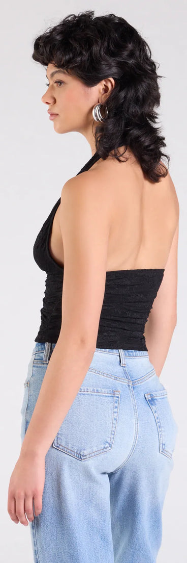 Complete your look with the Alluring Charm Lace Halter Top, a trendy black top that’s ready to pair with anything in your fall rotation.