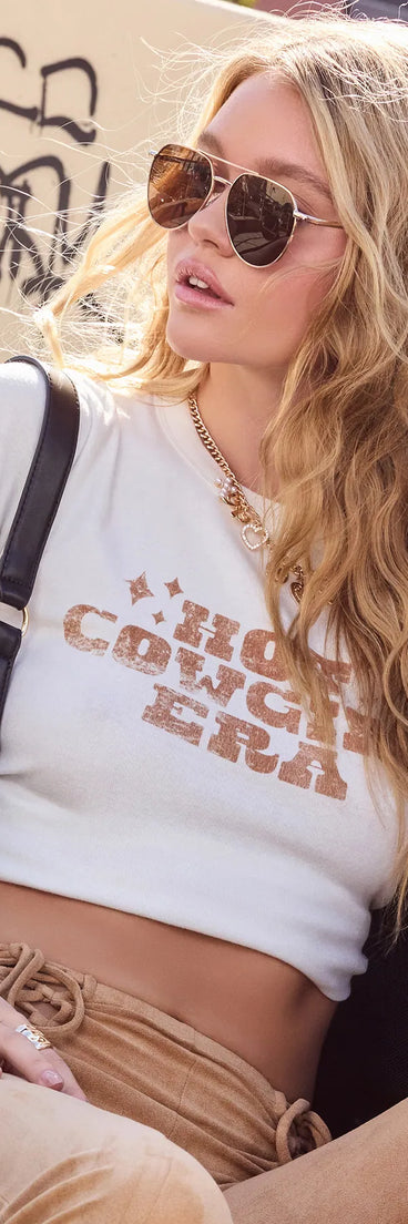 The Hot Cowgirl Era Graphic Tee in white brings edge and energy to your vibe, ready to elevate any festival look or concert outfit.