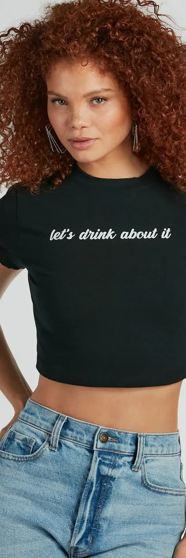 The Let's Drink About It Crop Graphic Tee in black with a modern design and trendy look is part of the latest women's tops collection to elevate your 2025 wardrobe.
