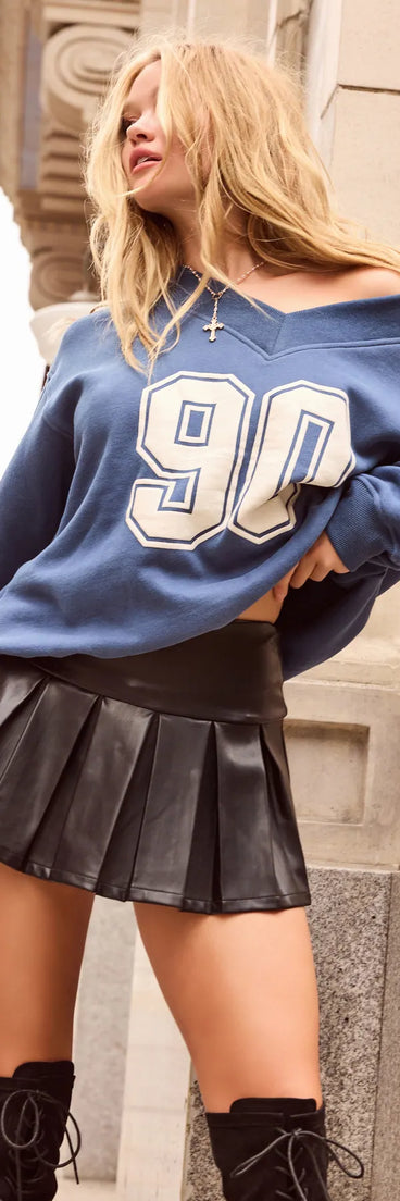 The 90 Graphic Oversized Pullover Sweatshirt in navy blue with a modern design and trendy look is part of the latest women's tops collection to elevate your 2025 wardrobe.