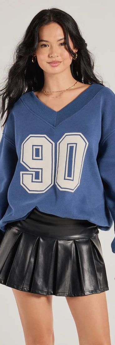 The 90 Graphic Oversized Pullover Sweatshirt in navy blue with a modern design and trendy look is part of the latest women's tops collection to elevate your 2025 wardrobe.