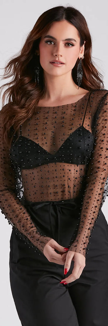 With its midriff cut and trend-forward fit, the Beautifully Beaded Mesh Crop Top is a black crop top made to pair with skirts, denim, or whatever vibe you're feeling this season.