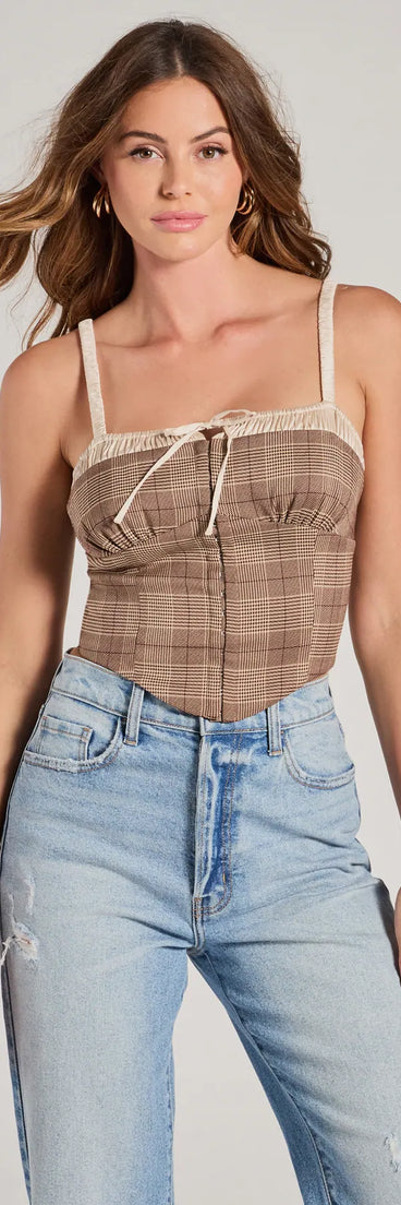 The waist-defining bodice style of the Pristine Classic Satin Trim Plaid Corset Crop Top in brown is perfect for making a statement with your outfit and provides the structure, molded cups, or lace-up details that capture the corset trend.