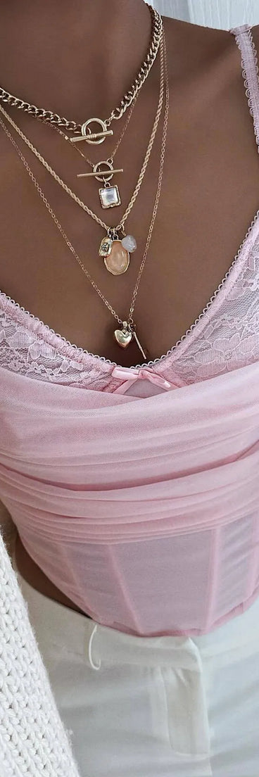 Stay on-trend this season with the Sultry Night-Out Lace Trim Mesh Bustier Top in pink, a must-have for creating stylish and effortless summer outfits for women.