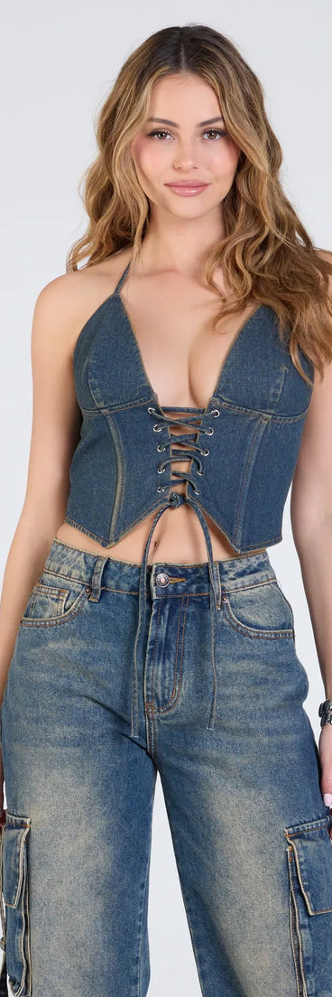 The Denim Cutie Halter Lace-Up Crop Top in denim blue brings edge and energy to your vibe, ready to elevate any festival look or concert outfit.