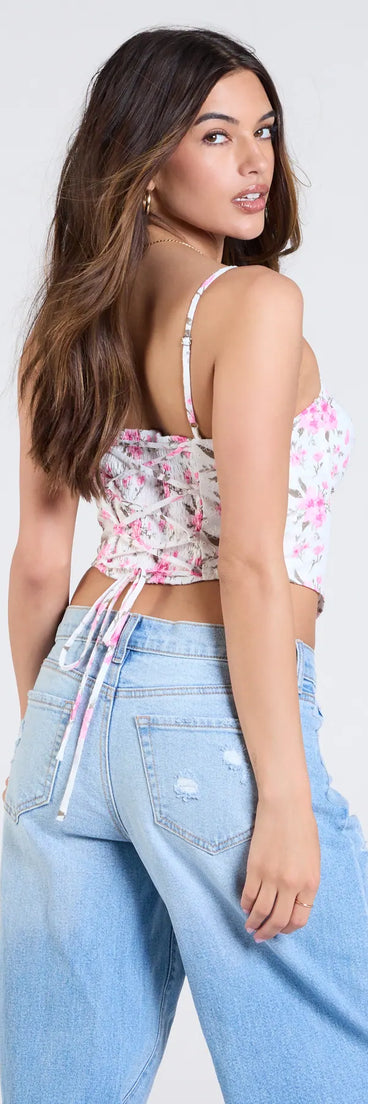 From bold to effortless, the Cheerful Blooms Floral Lace-Up Eyelet Bustier lets you define your vibe with white tops that speak your style.