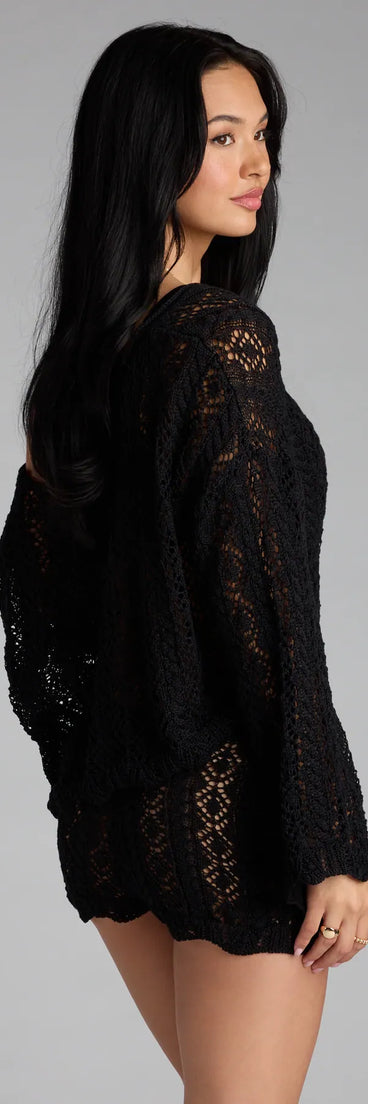 Add a sleek touch to your outfit with this black long sleeve top—the Breezy Nights Crop Crochet Sweater makes effortless transitions from desk to dinner.