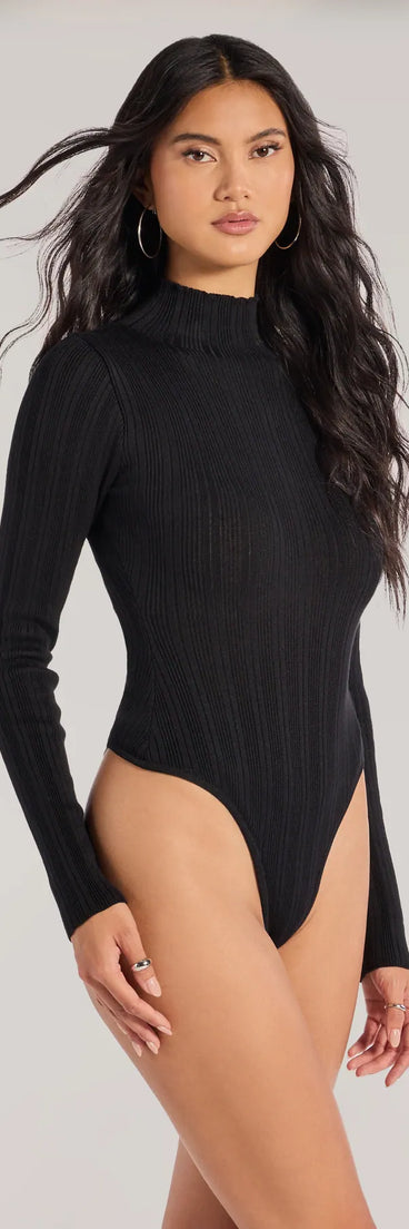 Add a sleek touch to your outfit with this black long sleeve top—the Winter Slay Turtleneck Long Sleeve Bodysuit makes effortless transitions from desk to dinner.