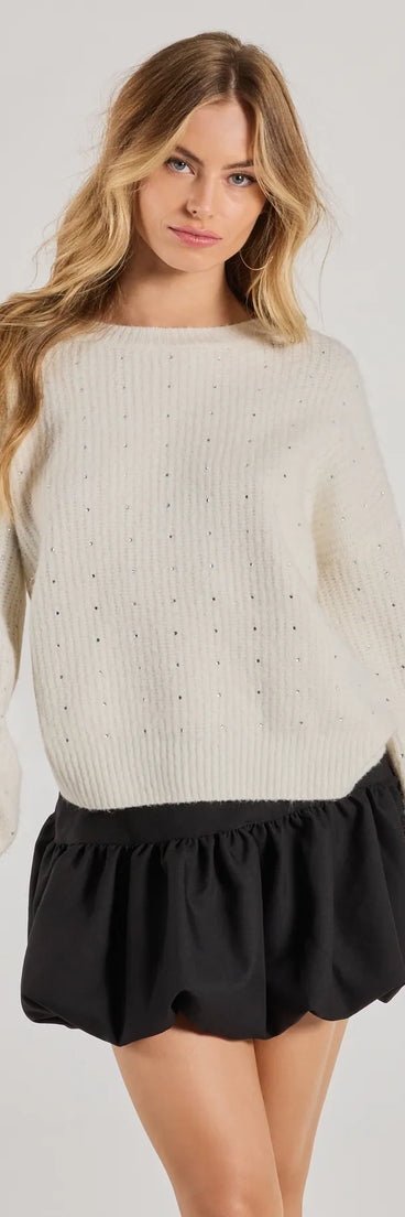 Layer-friendly Cozy Sparkle Rhinestone Ribbed Knit Sweater is a chic, transitional ivory long-sleeve top with contemporary sleeves and neckline design, ideal for an elevated cozy style or casual elegance.