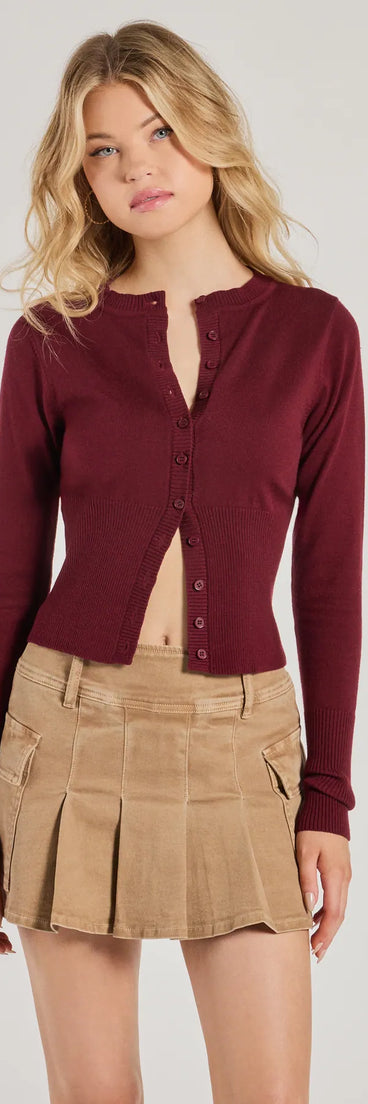 The Chic Staple Crew Neck Cropped Knit Cardigan in burgundy with a modern design and trendy look is part of the latest women's tops collection to elevate your 2025 wardrobe.