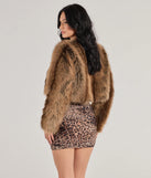 The Untamed Luxe Cropped Faux Fur Jacket in brown is a women's workwear essential with an elevated fabric and chic silhouette, ideal for layering and versatile enough to take your look from office chic to going-out ready!