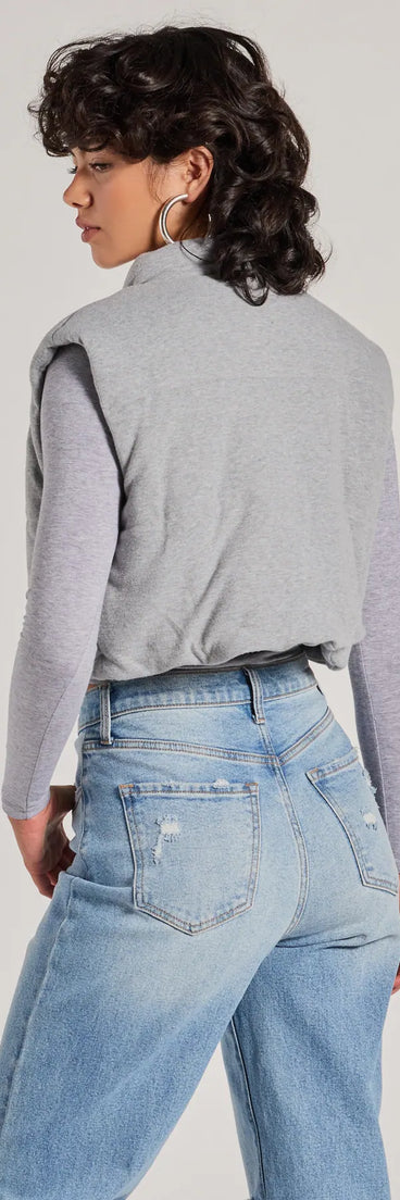 Stay chic this winter with Cozy Vibes Knit Cropped Puffer Vest, a heather gray women's coat perfect for layering. Featuring textured fabric and a trendy fit, this lightweight coat for women transitions effortlessly from cozy everyday wear to formal evening events.