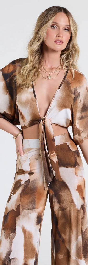Serve effortless style and scroll-stopping energy in the Off To Paradise Tie-Front Crop Top, part of a brown matching clothing set that does the work for you with bold, polished vibes from top to bottom.