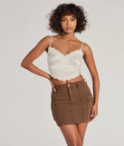 The Serving Style Cargo Mini Skirt is a brown cargo skirt, an effortlessly layer-friendly piece ideal for a holiday-ready look with a funtional-inspired flair.