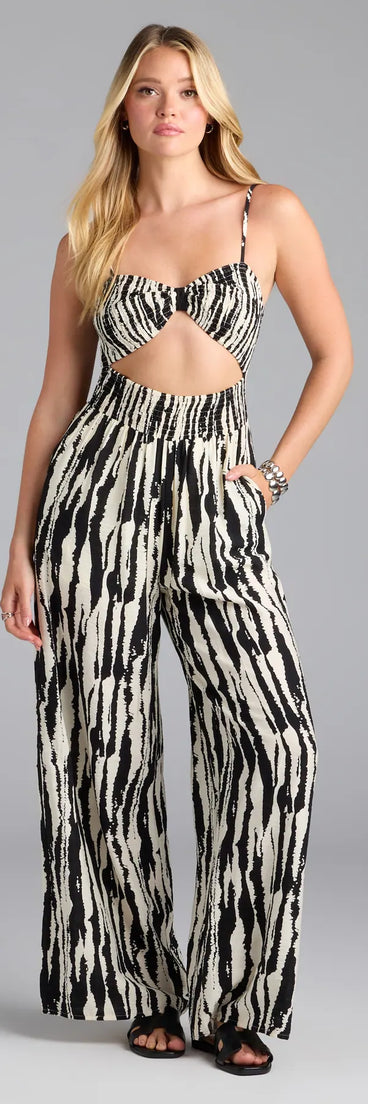 Upgrade your seasonal wardrobe with the Remarkable Energy Abstract Striped Wide-Leg Jumpsuit, a trendy jumpsuit in black made to mix, match, and stand out.