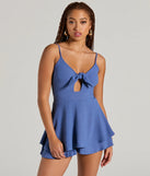 The Flirty Look Tie-Front Ruffled Romper is an elevated one-piece that blends sleek sophistication with playful charm, perfect for nailing casual or formal outfits.