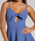 The Flirty Look Tie-Front Ruffled Romper is an elevated one-piece that blends sleek sophistication with playful charm, perfect for nailing casual or formal outfits.