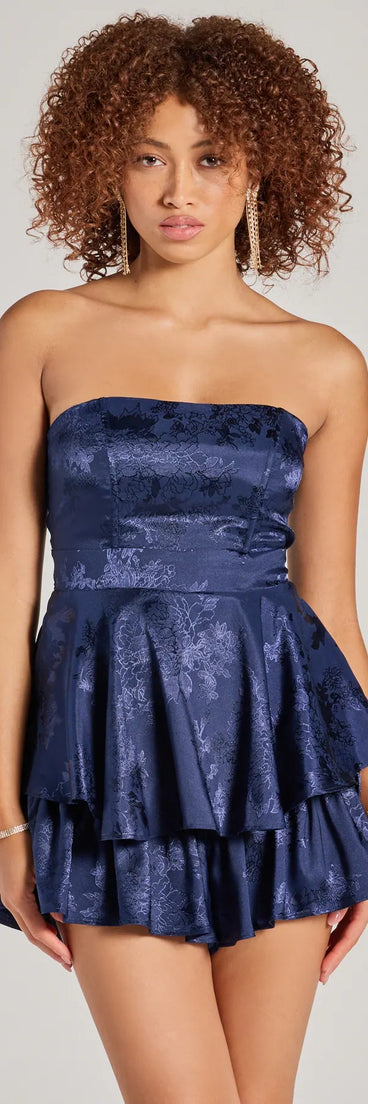 With its easy fit and flirty cut, the Irresistible Darling Strapless Tie Waist Satin Romper is a navy blue one-piece that brings fun, freedom, and movement to your weekend look.