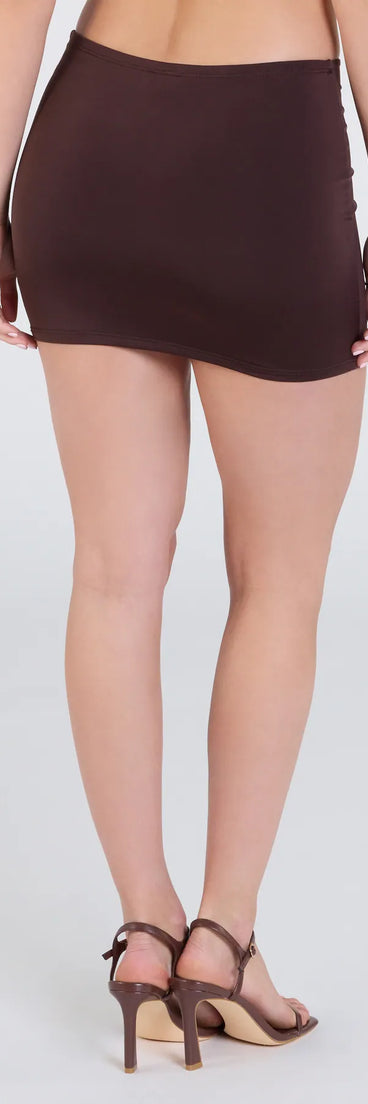 The Cutie At Heart Cutout Mini Skirt in brown features a short, flattering cut designed to elevate your look with just the right amount of edge.