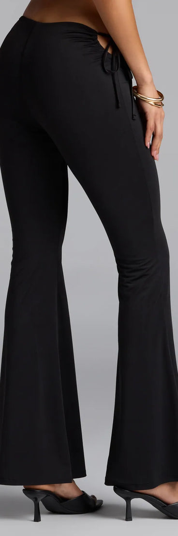 Style up your rotation with the Sleek Look Mid-Rise Cutout Flare Pants, trendy black pants made to anchor every outfit with attitude and ease.