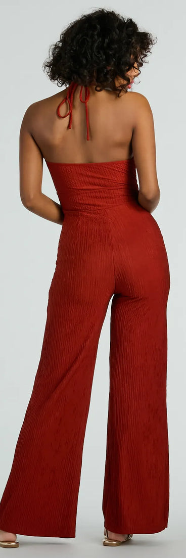 The Sunny Energy Halter Cut Out Wide Leg Jumpsuit is a trendy women's bottom in rust, designed with modern details and alluring textures to complete chic outfits for 2025.