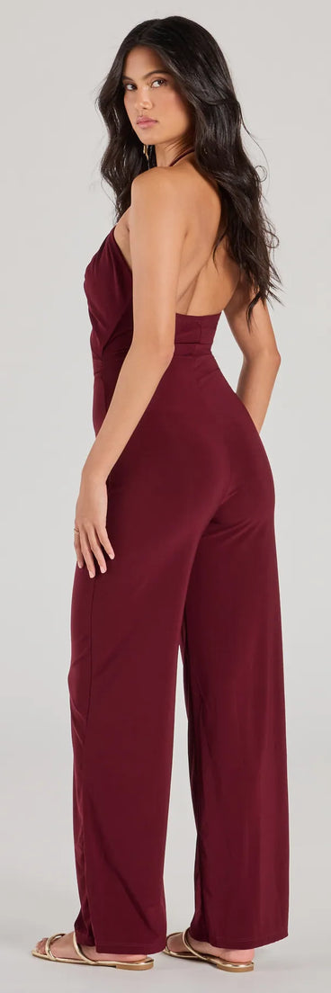 The Enticing Sass Halter Cutout Wide-Leg Jumpsuit is a trendy women's bottom in plum, designed with modern details and alluring textures to complete chic outfits for 2025.