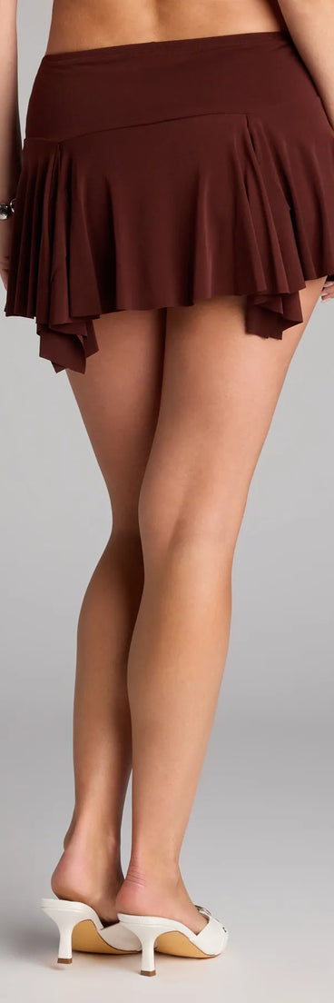 Designed for campus outfits, sleek workwear, and on-the-go moments, the Serving Moves Ruched Hanky Hem Mini Skort is a trendy brown bottom for women bringing effortless fall versatility.