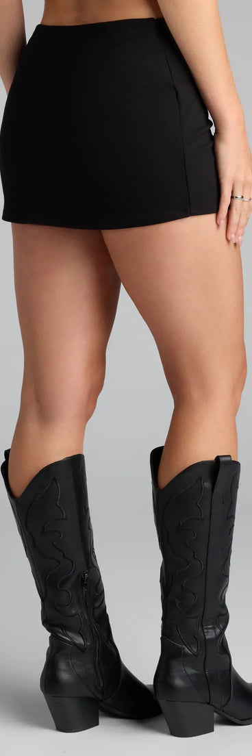 Style up your rotation with the Buckle Up Babe Belted Wrap Skort, a trendy black skort made to anchor every outfit with attitude and ease.