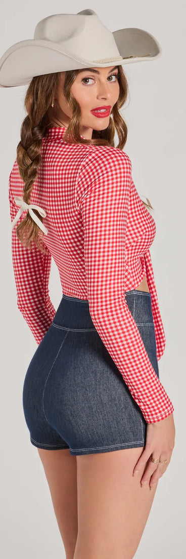 Perfect as a dress alternative for a New Year's outfit, wedding guest attire, and cocktail party dress alike, the Rodeo Cowgirl Gingham Tie-Front Romper is a women's red romper that combines a stylish, unique design with festive colors and holiday-ready details for a standout look!