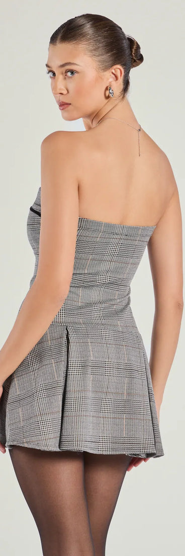 The Adorable Factor Plaid Strapless Drop Waist Romper is a trendy women's bottom in black, designed with modern details and alluring textures to complete chic outfits for 2025.