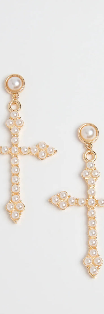 The Blessed Style Faux Pearl Cross Earrings in gold brings edge and energy to your vibe, ready to elevate any festival look or concert outfit.