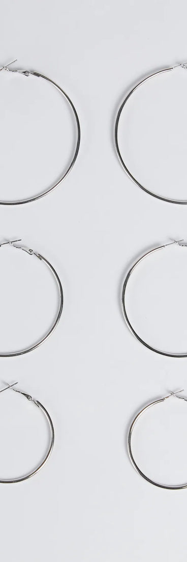 The Essential Three-Pack Hoop Earrings Set in silver is a women's workwear essential with an elevated fabric and chic silhouette, ideal for layering and versatile enough to take your look from office chic to going-out ready!
