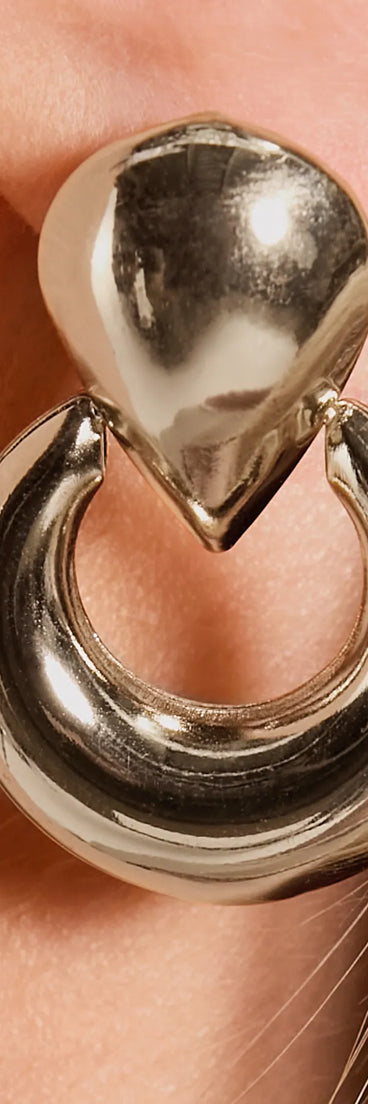 The Keep It Chic Doorknocker Hoop Earrings in gold is a women's workwear piece offering a trendy style and unique accents, perfect for effortlessly creating an outfit-of-the-day look that transitions your office look to going-out ready.