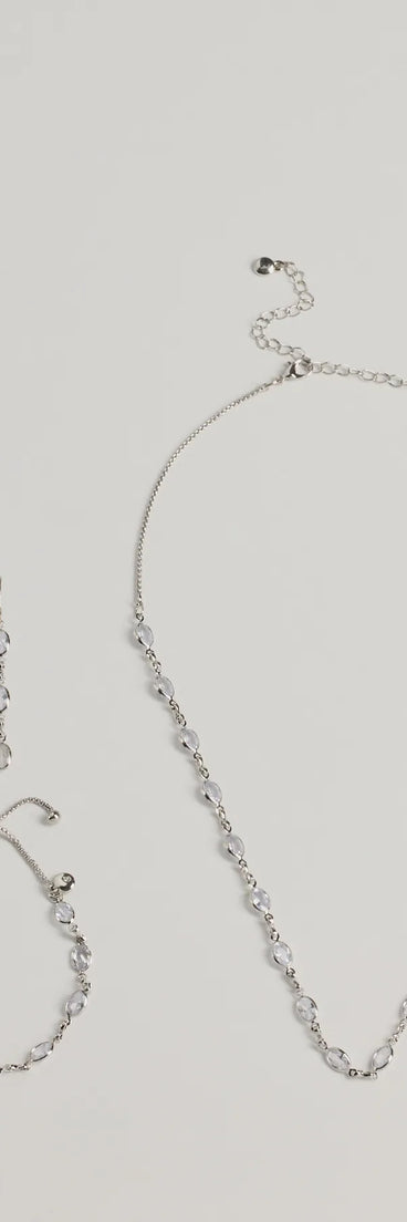 The Bloom In Sparkles Necklace, Earrings, And Bracelet Set helps create a chic silver women's cocktail outfit with a trendy texture and stylish design, ideal for wedding guest cocktail outfits or dinner parties