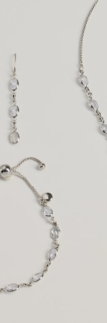 The Bloom In Sparkles Necklace, Earrings, And Bracelet Set helps create a chic silver women's cocktail outfit with a trendy texture and stylish design, ideal for wedding guest cocktail outfits or dinner parties