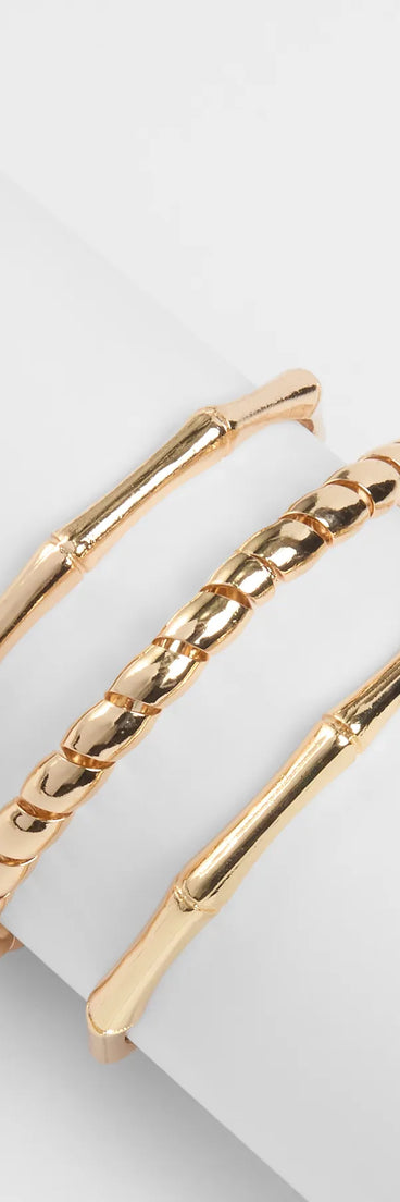 Stay on-trend this season with the Three's A Crowd Bangle Bracelet Set in gold, a must-have for creating stylish and effortless spring outfits for women.