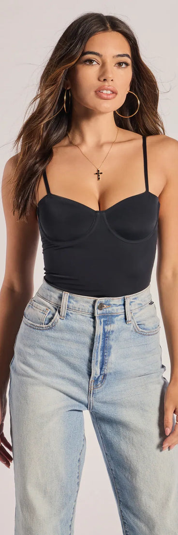 Elevate your winter outfits with the One Sided Sleeveless Cutout Bodysuit, a black bodysuit designed for confident and effortless styling with anything from mini skirts to high-waist jeans.