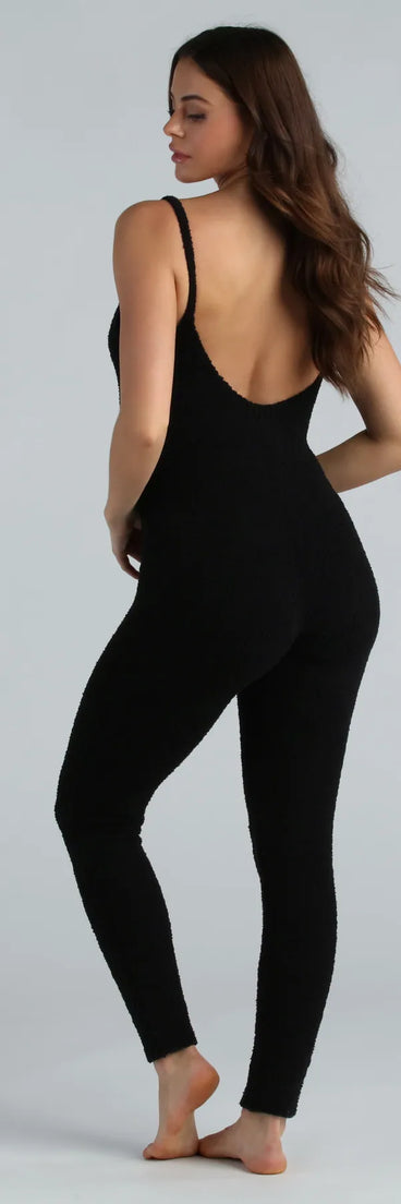 The Dressed To Lounge Chenille Knit Catsuit in black is a sleek women's catsuit featuring a chic, body-hugging silhouette with on-trend details for a striking profile, perfect for creating going-out looks or party outfits.